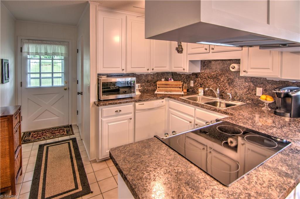 1596 Beckner Road Lexington, NC 27292 - Photo 19 of 29 Kitchen with tile floor, dishwasher, smooth top convection oven & pantry. Microwave & new refrigerator are negotiable!