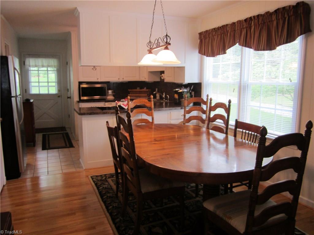 1596 Beckner Road Lexington, NC 27292 - Photo 21 of 29 Dining/living combo with beautiful hardwood floors!