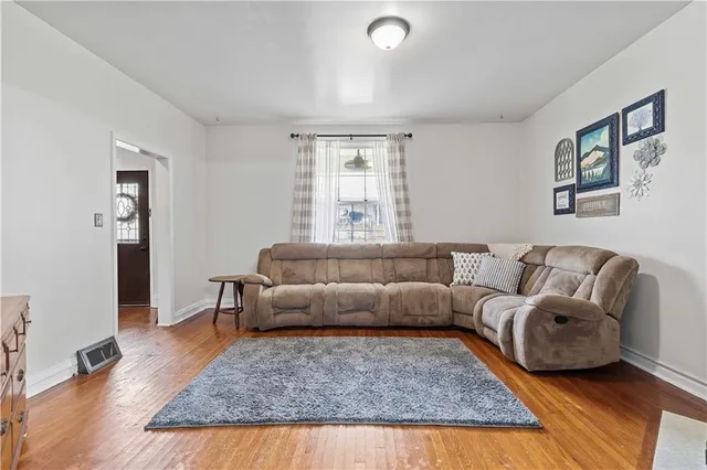 a clock on a wall next to a window