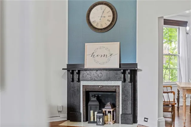 a spacious bedroom with a bed and a potted plant