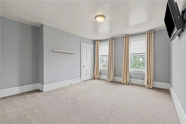 a view of an empty room with a flat screen tv