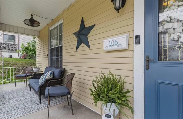 a view of an entryway with wooden floor and stairs