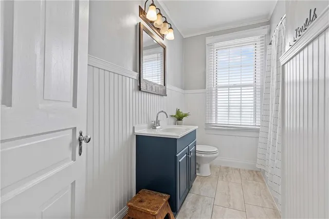 a bedroom with furniture and a wooden floor