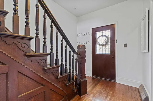 a kitchen with granite countertop a sink stove and refrigerator
