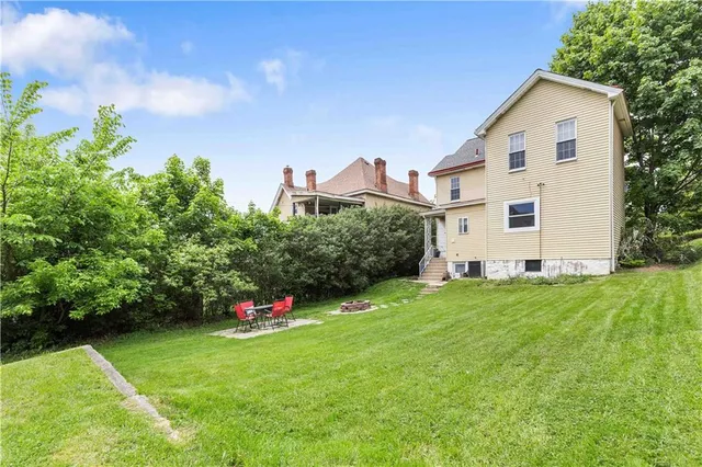 a front view of a house with sitting space and garden