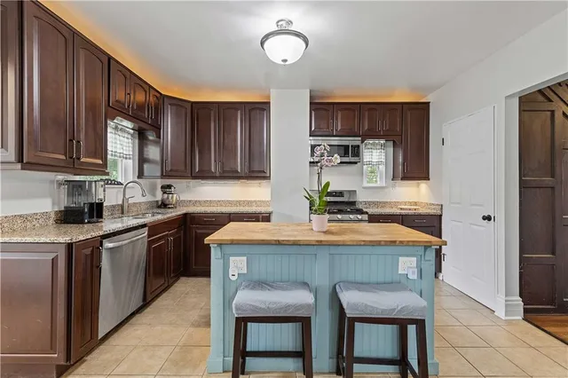 a kitchen with a stove and a sink