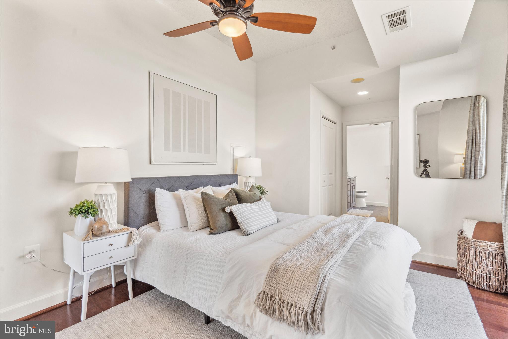 3650 South Glebe Road, Unit 1050 Arlington, VA 22202 - Photo 23 of 47 a bedroom with a bed and a chandelier