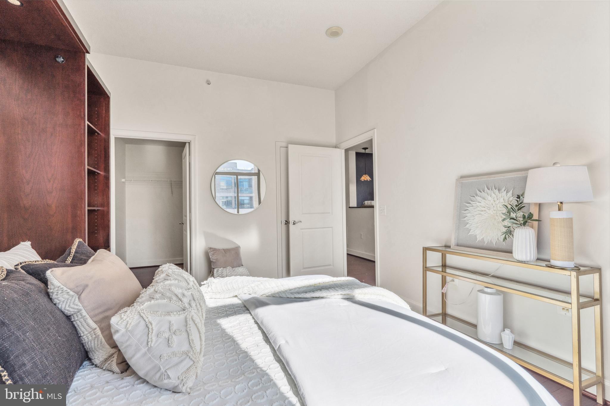 3650 South Glebe Road, Unit 1050 Arlington, VA 22202 - Photo 33 of 47 a bedroom with a bed and a chandelier