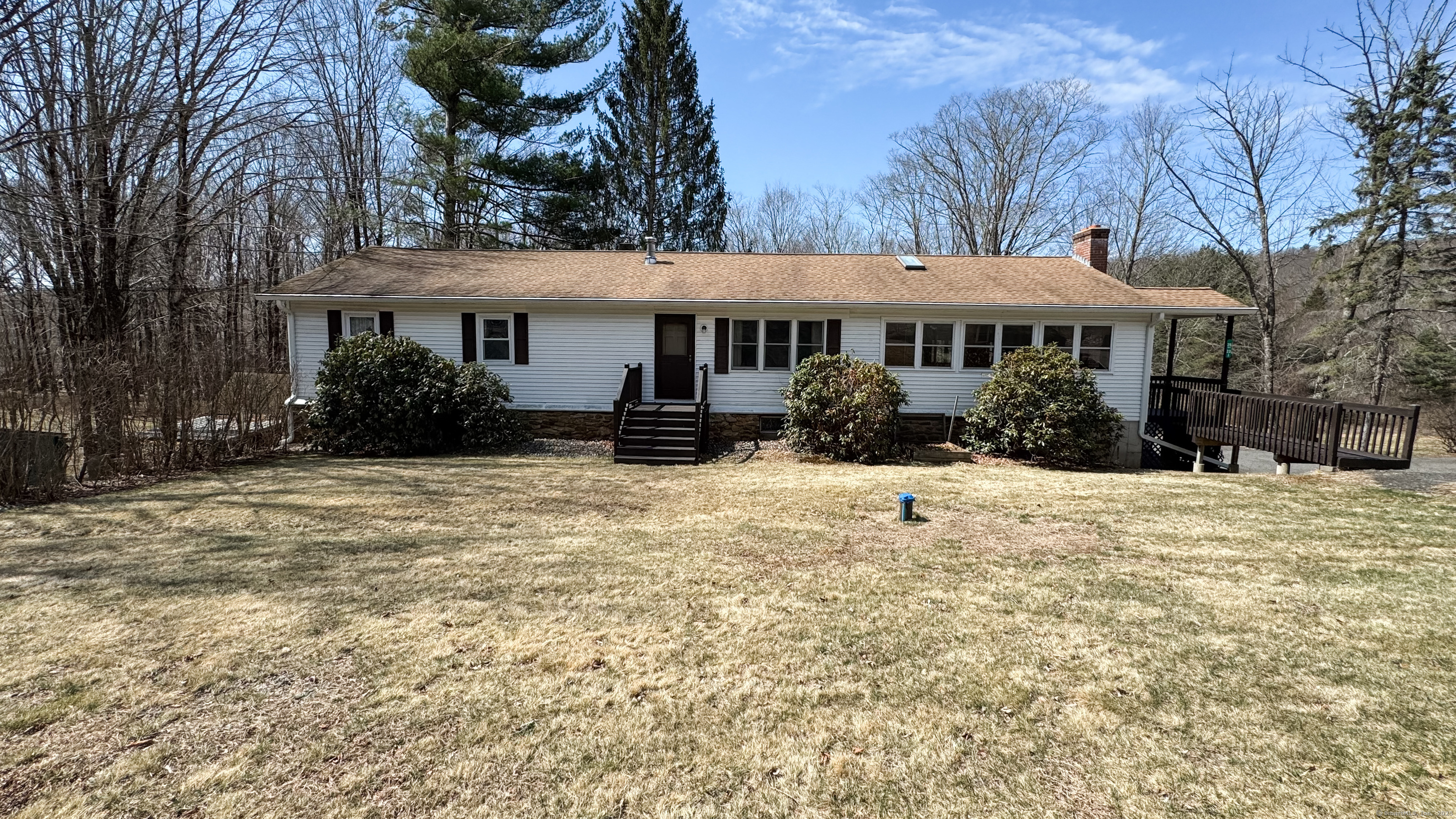 23-25 Waterfall Road Ashford, CT 06278 - Photo 1 of 1 a front view of a house with a yard