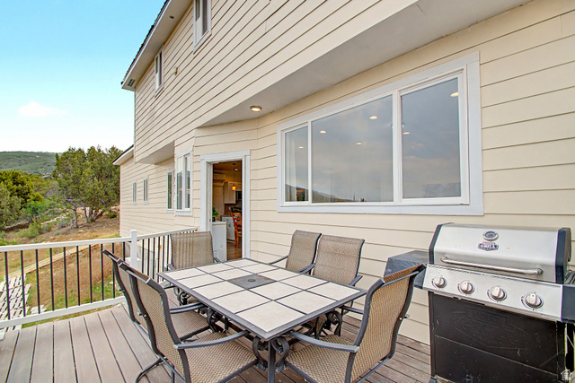 12645 East Cedar Ridge Drive Fairview, UT 84629 - Photo 28 of 34 Expansive outdoor deck featuring wood-finish flooring and black metal railings