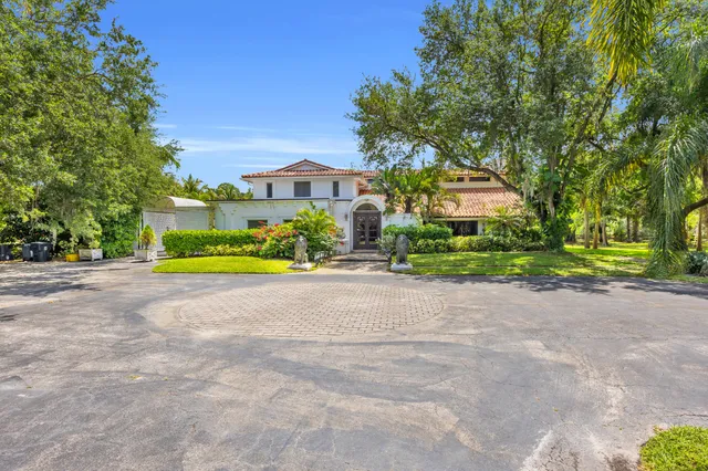 a view of house with outdoor space and street view