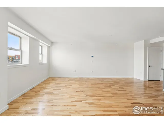 a view of kitchen with wooden floor