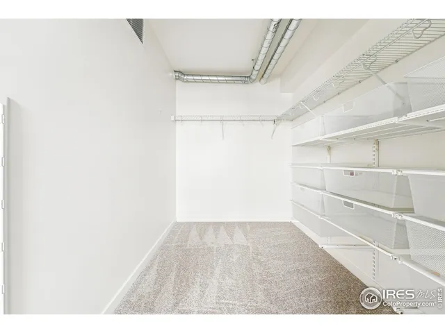 a bathroom with a granite countertop sink mirror vanity and toilet