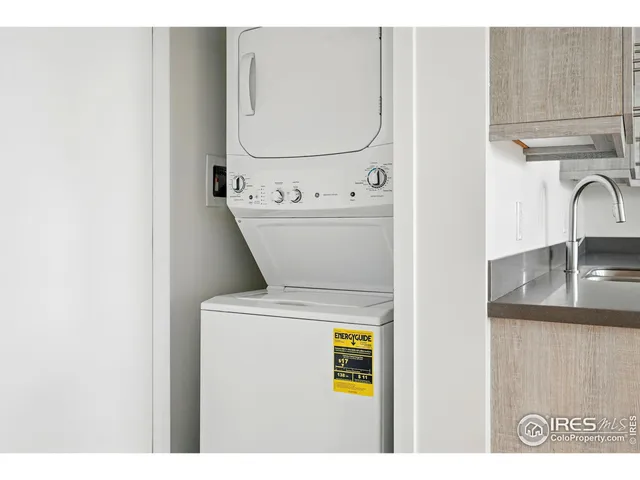 a kitchen with a refrigerator and a sink