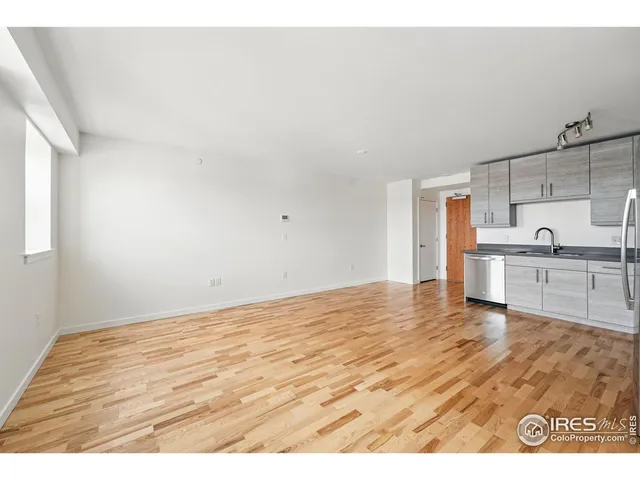 a view of kitchen with wooden floor