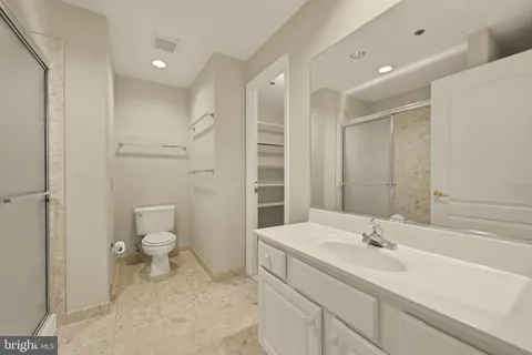 a bathroom with a glass shower door