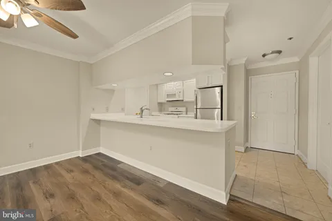 a view of kitchen with wooden floor