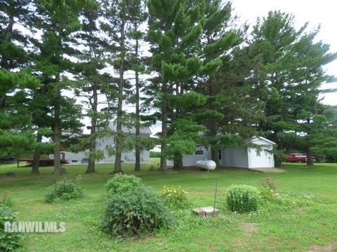 15476 West Nora Road Winslow, IL 61089 - Photo 20 of 23 a green field with lots of trees
