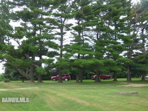 15476 West Nora Road Winslow, IL 61089 - Photo 21 of 23 a backyard of a house with table and chairs