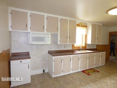15476 West Nora Road Winslow, IL 61089 - Photo 3 of 23 a spacious bathroom with a granite countertop sink and a mirror