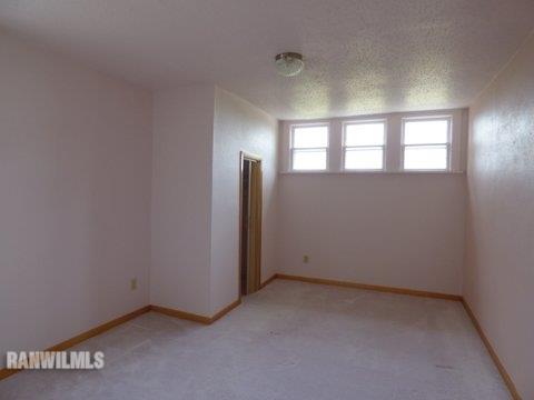 15476 West Nora Road Winslow, IL 61089 - Photo 10 of 23 an empty room with a empty space and windows