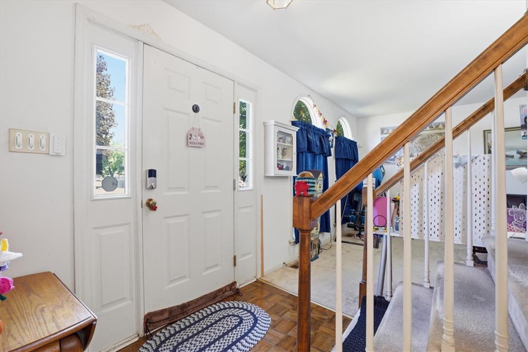 808 Hunter Road Easton, PA 18040 - Photo 3 of 41 A welcoming entry invites with a bright doorway and a staircase leading to the upper level.