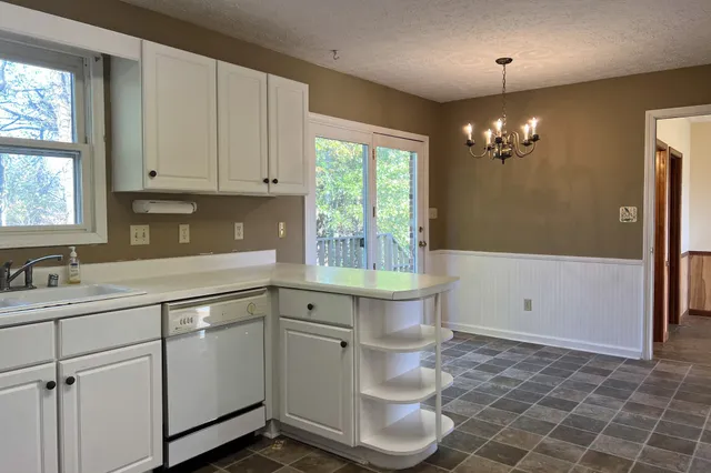 a bathroom with a sink a toilet and bathtub