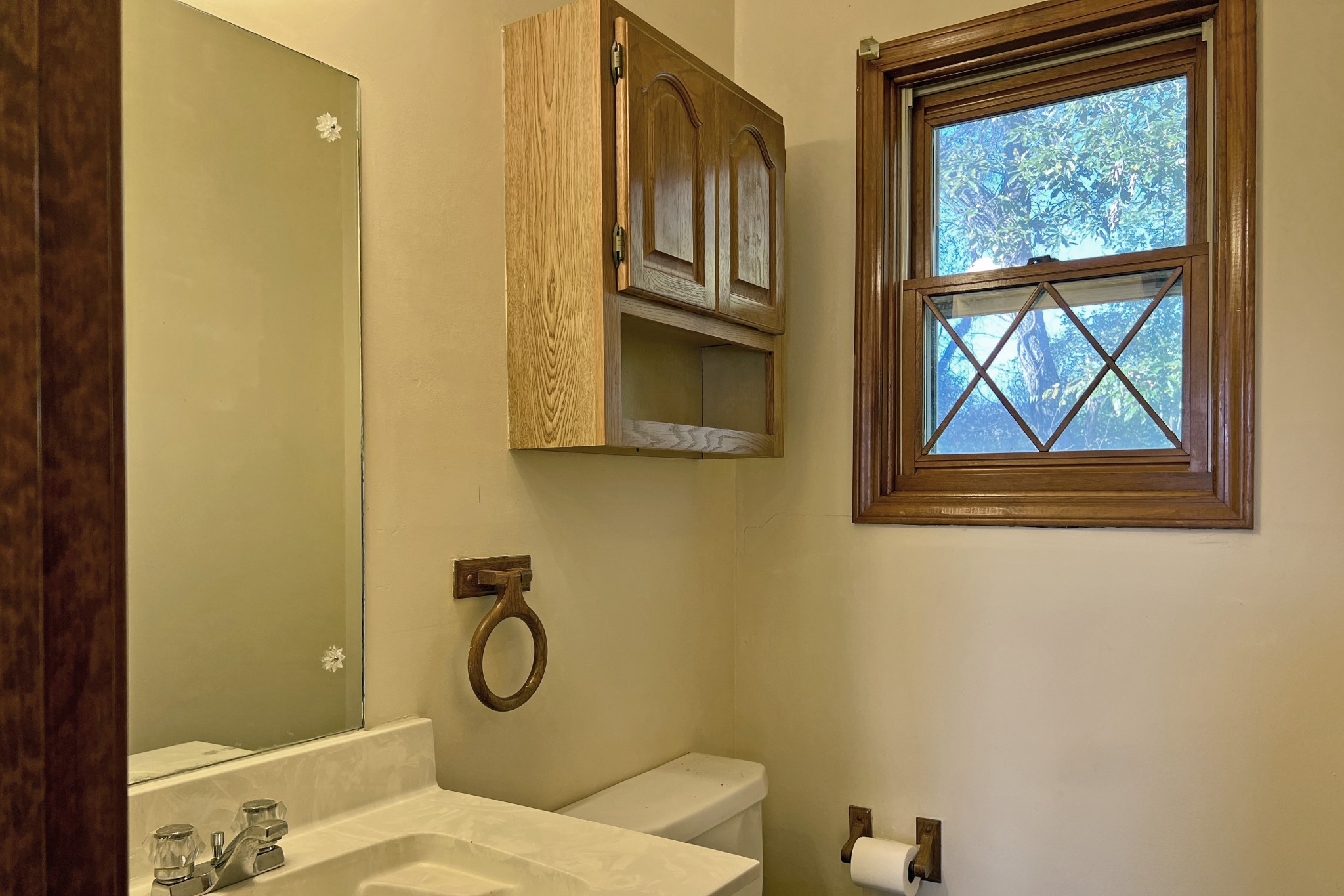 1015 Salem Road Franklin, KY 42134 - Photo 17 of 61 a bathroom with a granite countertop toilet a sink and a window