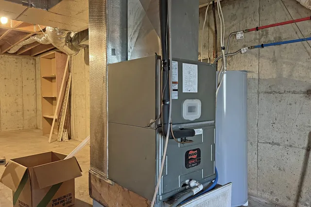 a view of a yard in front of a house with large trees