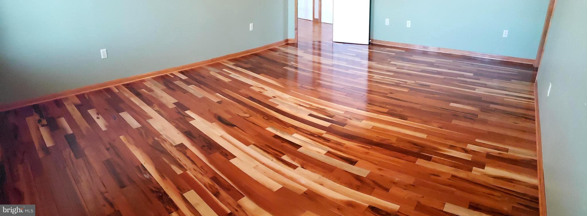 2031 Peters Corner Road Marydel, MD 21649 - Photo 20 of 45 Master bedroom with tiger cherry flooring