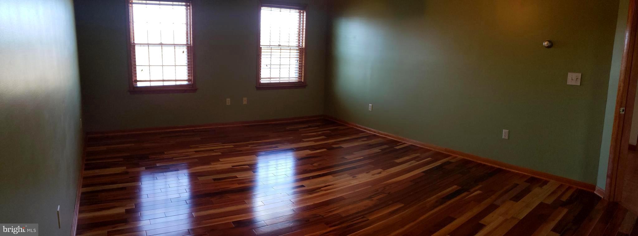 2031 Peters Corner Road Marydel, MD 21649 - Photo 22 of 45 Master bedroom with tiger cherry flooring