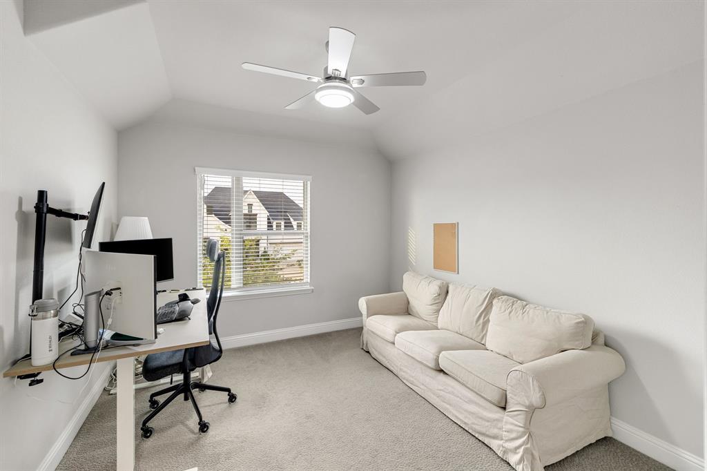 7852 Buffaloberry Road Frisco, TX 75035 - Photo 24 of 36 Room featuring vaulted ceilings and neutral carpeting