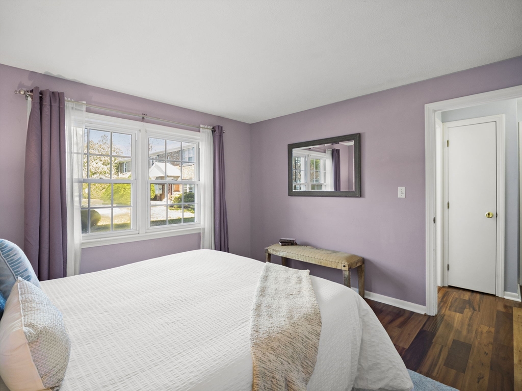9 Elm Street, Unit 1 Acton, MA 01720 - Photo 16 of 29 a bedroom with a bed and a large window