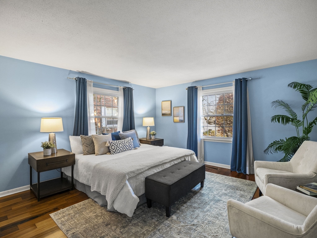 9 Elm Street, Unit 1 Acton, MA 01720 - Photo 19 of 29 a bedroom with a bed and a couch