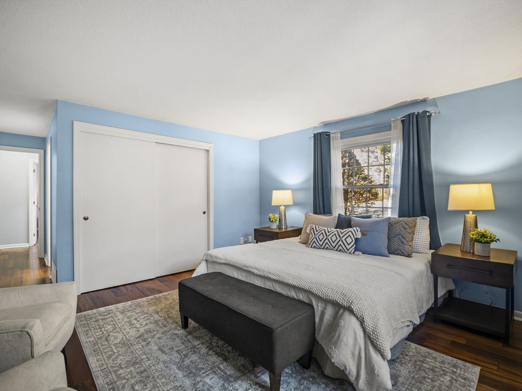 9 Elm Street, Unit 1 Acton, MA 01720 - Photo 20 of 29 a bedroom with a bed and a couch