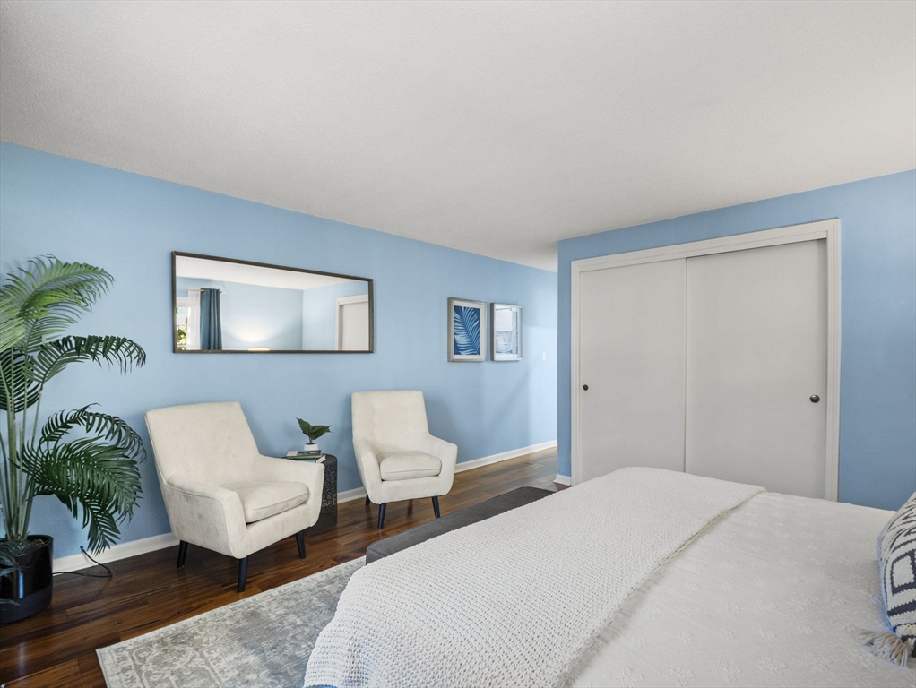 9 Elm Street, Unit 1 Acton, MA 01720 - Photo 22 of 29 a bedroom with a bed and a couch