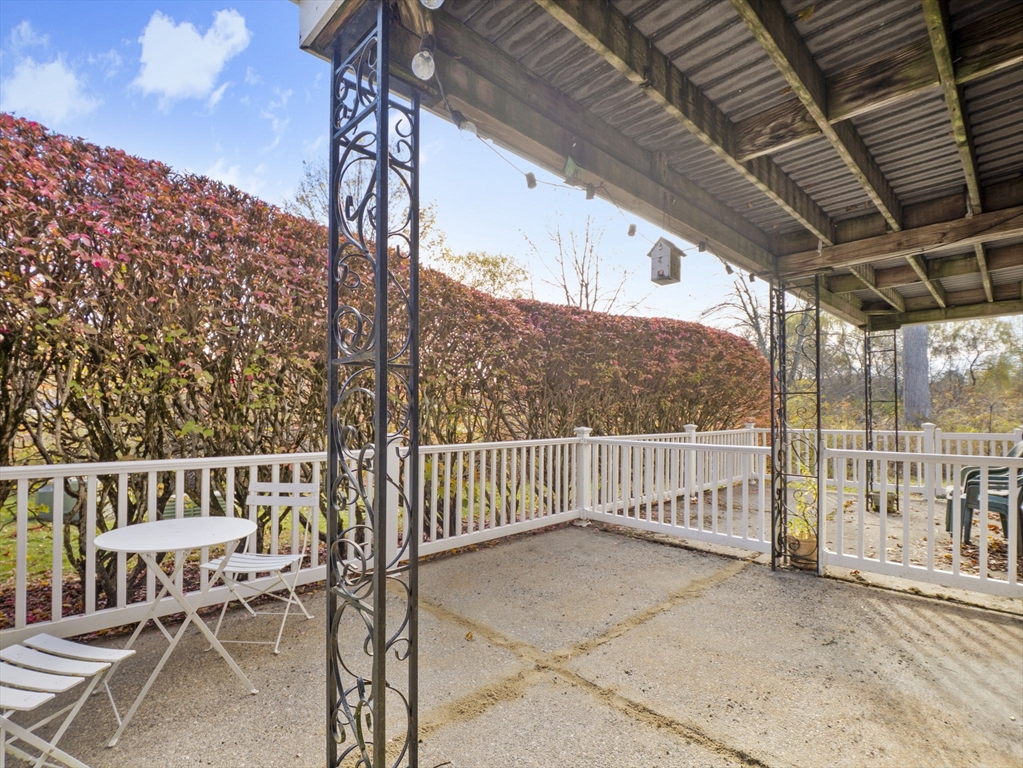 9 Elm Street, Unit 1 Acton, MA 01720 - Photo 25 of 29 a view of a chairs setting on the roof deck