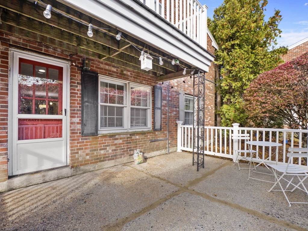 9 Elm Street, Unit 1 Acton, MA 01720 - Photo 26 of 29 a porch with seating space