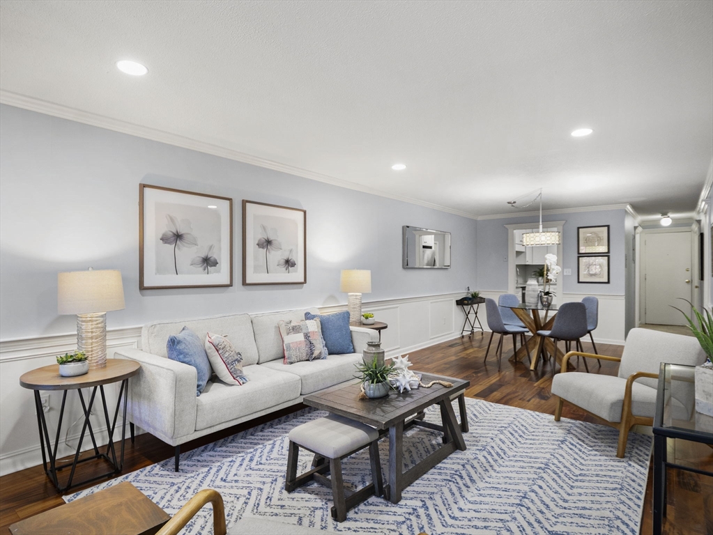 9 Elm Street, Unit 1 Acton, MA 01720 - Photo 4 of 29 a living room with furniture and wooden floor