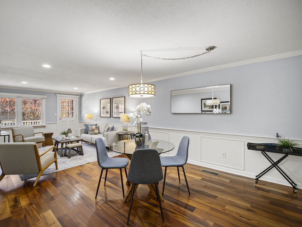 9 Elm Street, Unit 1 Acton, MA 01720 - Photo 6 of 29 a view of a dining room with furniture a rug and wooden floor