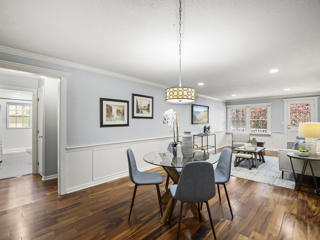 9 Elm Street, Unit 1 Acton, MA 01720 - Photo 7 of 29 a view of a dining room with furniture window and wooden floor