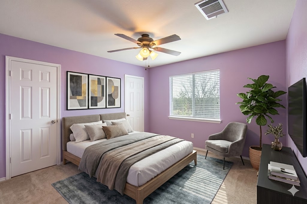 508 Emma Rose Trail Leander, TX 78641 - Photo 17 of 40 A comfortable bedroom with soft carpeting and natural light from a broad window.