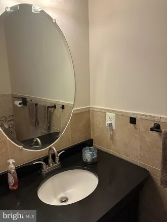 a bathroom with a sink and mirror
