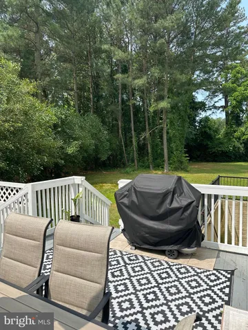 a view of a chair and fire pit in the patio