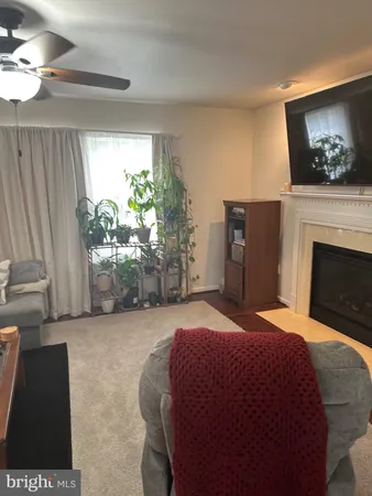 a bedroom with a bed and a fireplace