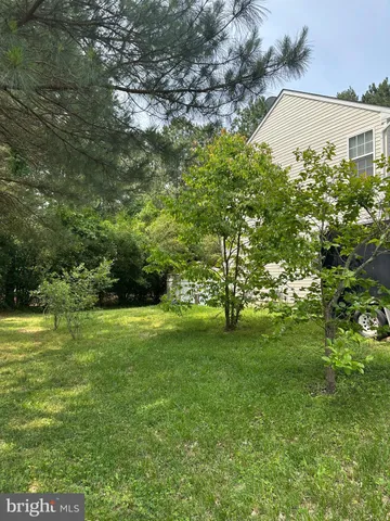 a view of a big yard with a house