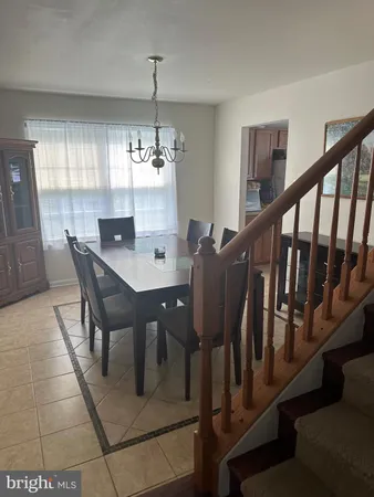 a view of a dining room with furniture and window