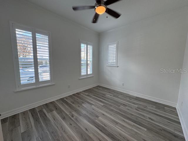 1515 Resolute Street Celebration, FL 34747 - Photo 13 of 39 a view of an empty room with wooden floor and window