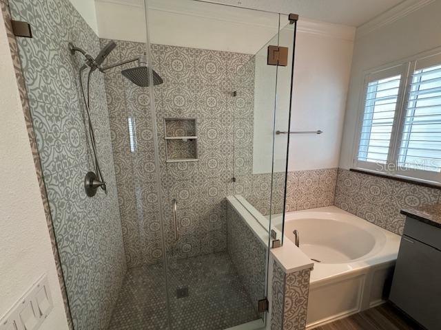 1515 Resolute Street Celebration, FL 34747 - Photo 19 of 39 a bathroom with a bathtub and a shower