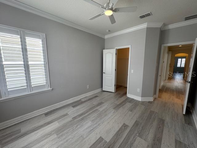 1515 Resolute Street Celebration, FL 34747 - Photo 27 of 39 an empty room with wooden floor and windows